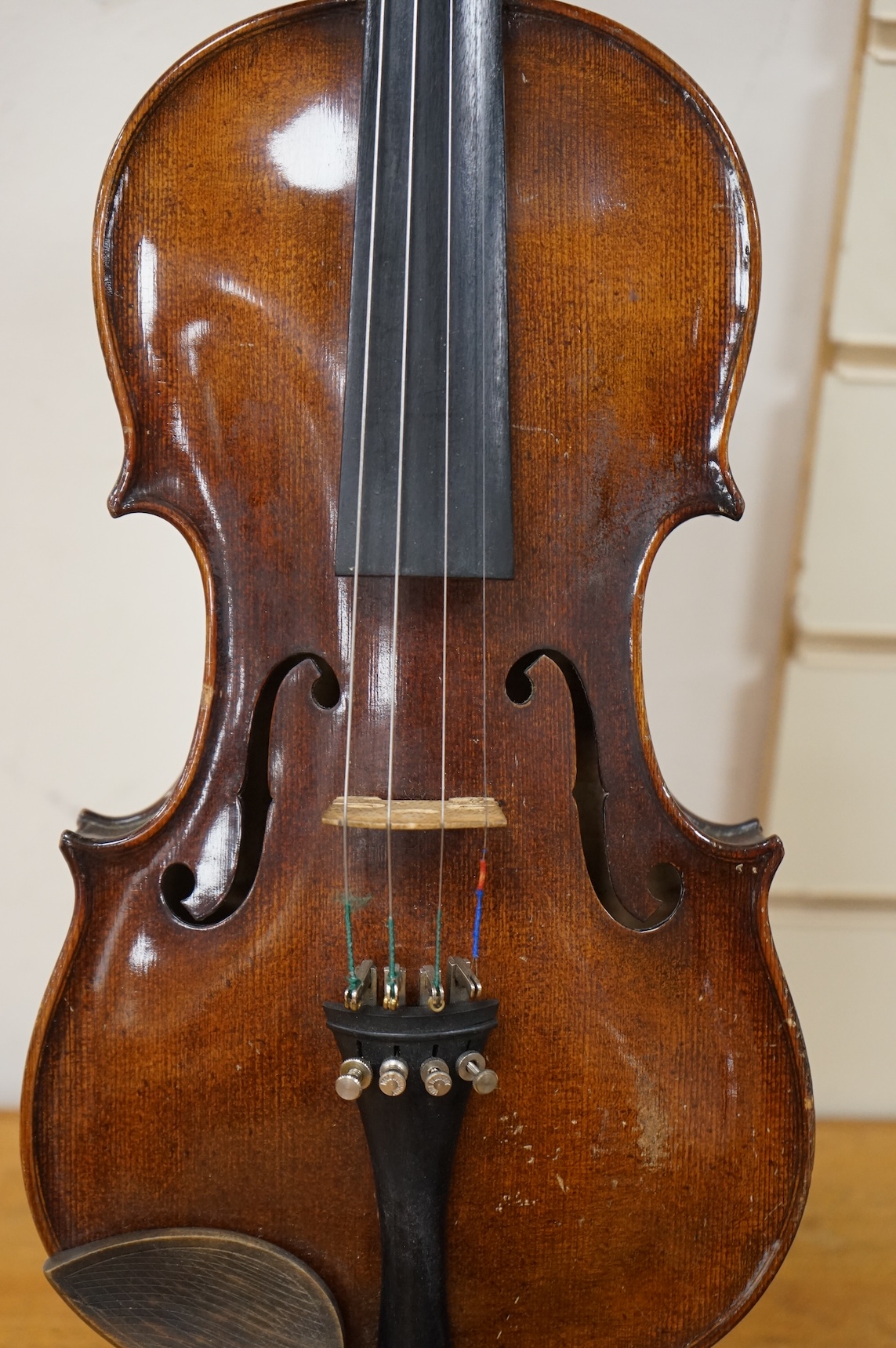 A late 19th century violin, with label for J.B. Schweitzer, 7/8 size, no bow, in case